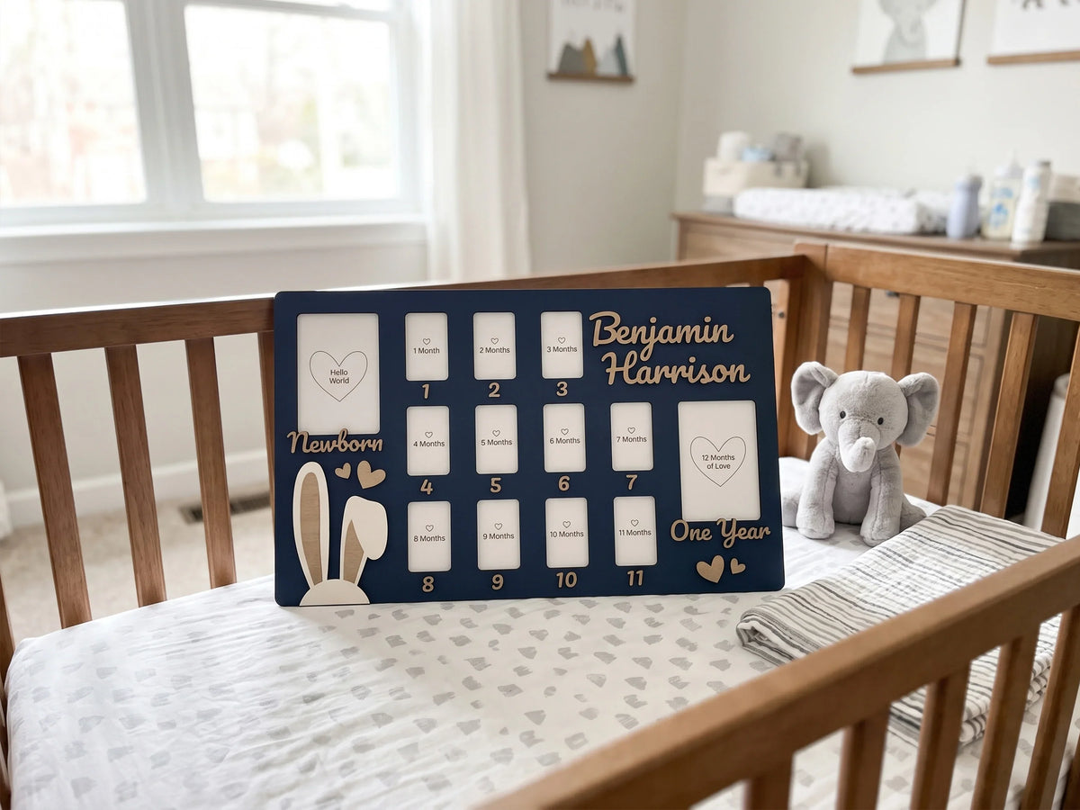 Personalized Baby First Year Photo Frame by The Frame Depot on a baby crib.