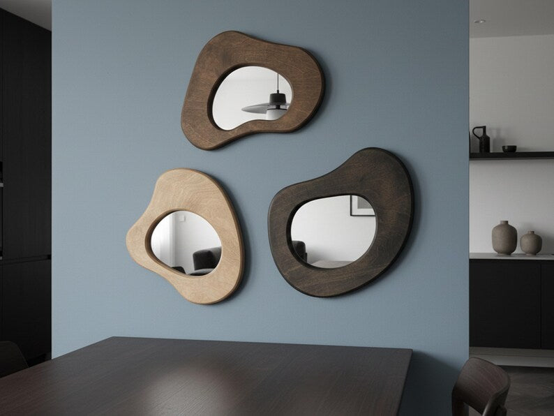 Fluid mirror trio in a modern neutral interior with handcrafted wood frames