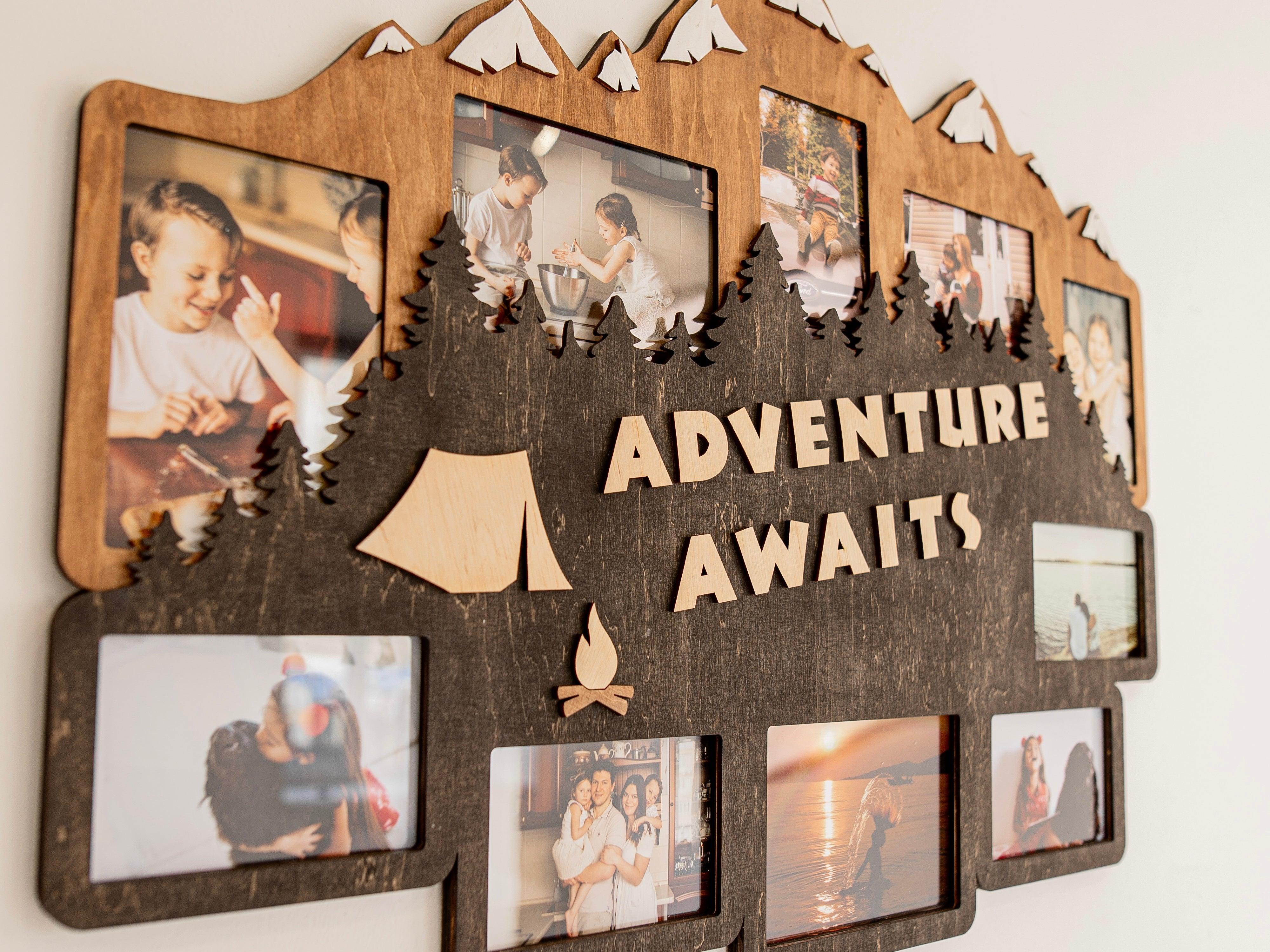 Wooden photo frame collage decorated with mountains, forest, and a tent with fire as well as adventure awaits text in the middle. This collage is 23 by 31 inches and has 10 frames. Trees and mountains can be painted in different colors.