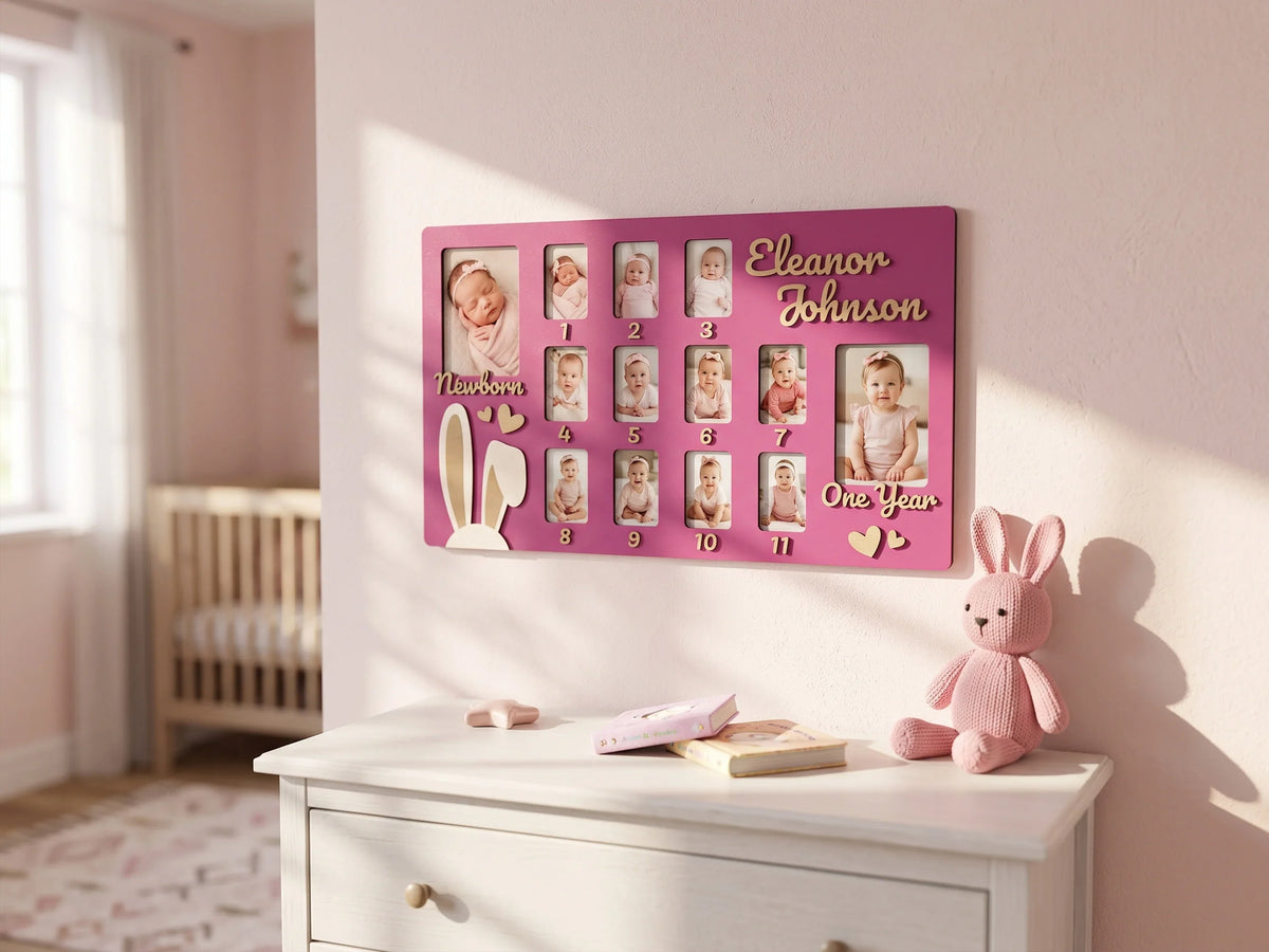 Personalized baby first year photo frame by The Frame Depot in pink with monthly milestone photos