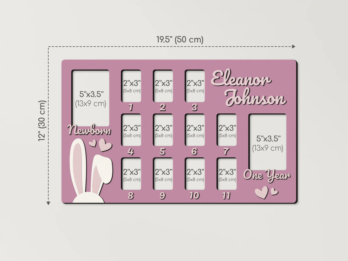 Personalized pink baby first year collage frame by The Frame Depot with monthly photo slots.