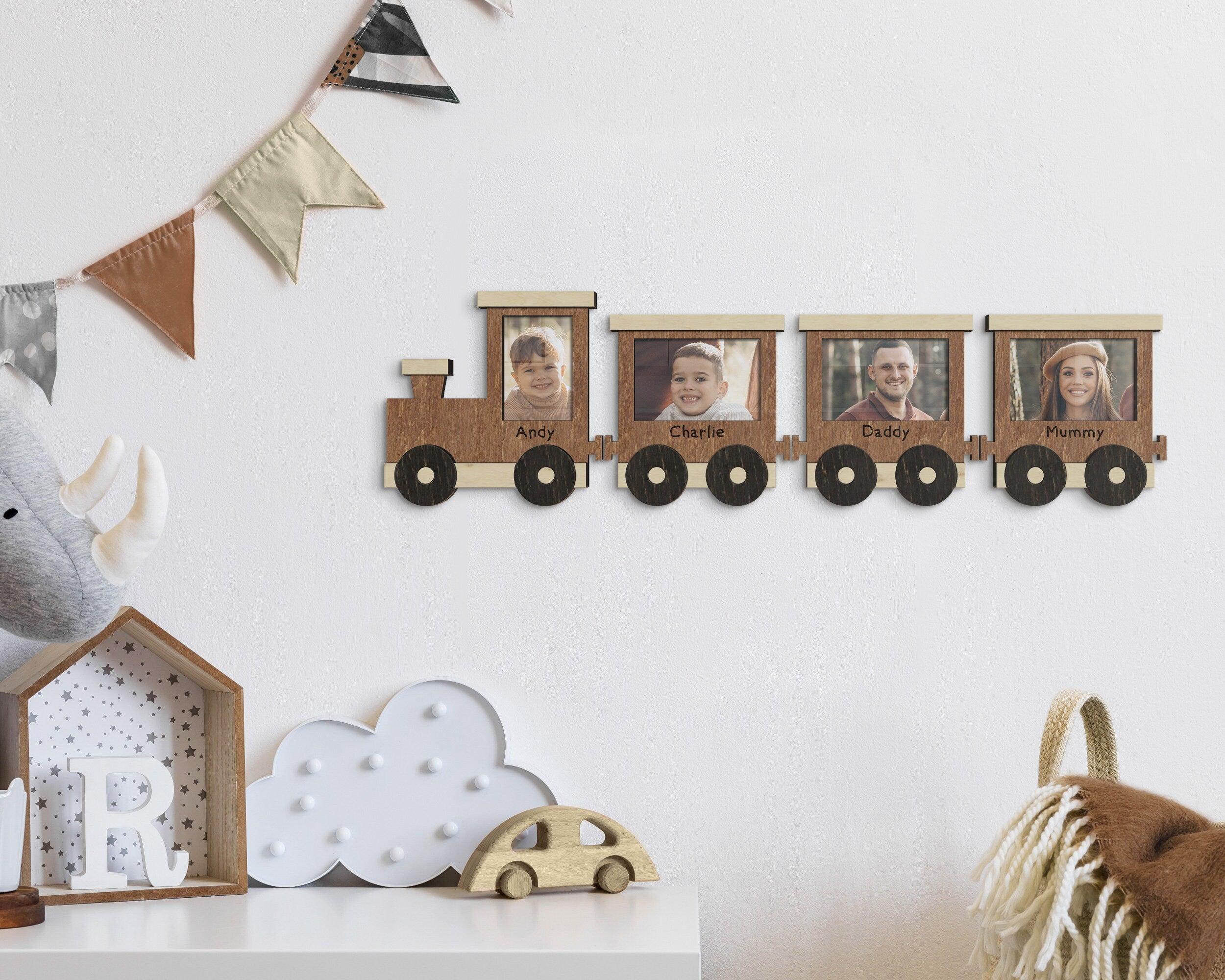 Personalized train pulling 3 wagons, photos can be placed in each wagon. Names can be engraved on each piece. A different number of wagons can be purchased at once. Train can be painted in different colors. Train is 10 by 10 inches wagon is 9 by 8.