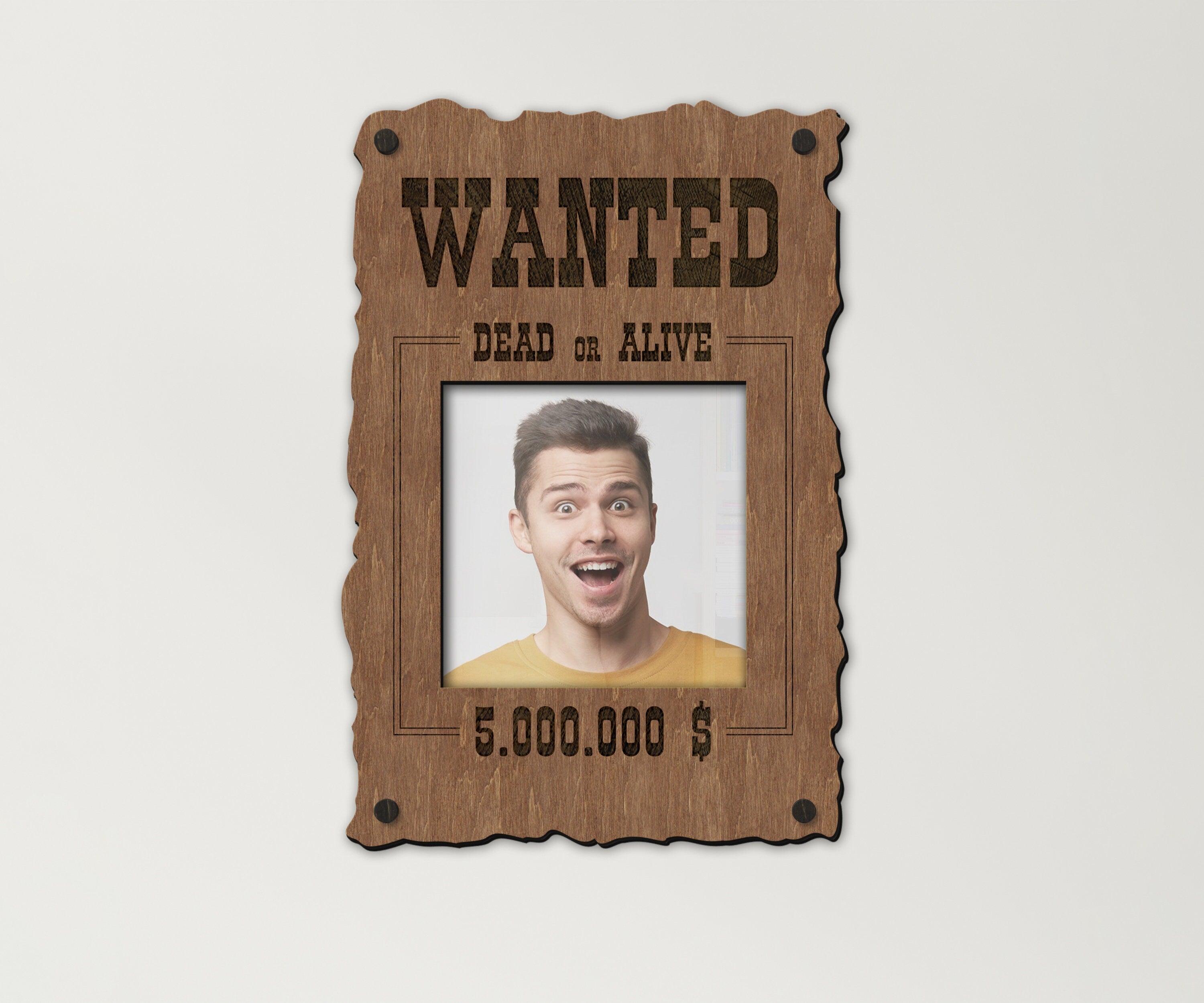 A wooden picture frame in a shape of a Wanted poster. WIth a text Wanted, dead or alive 5 million bounty. Three sizes available. Can be painted in 6 colors. Dollar sigh can be changed to other currency.